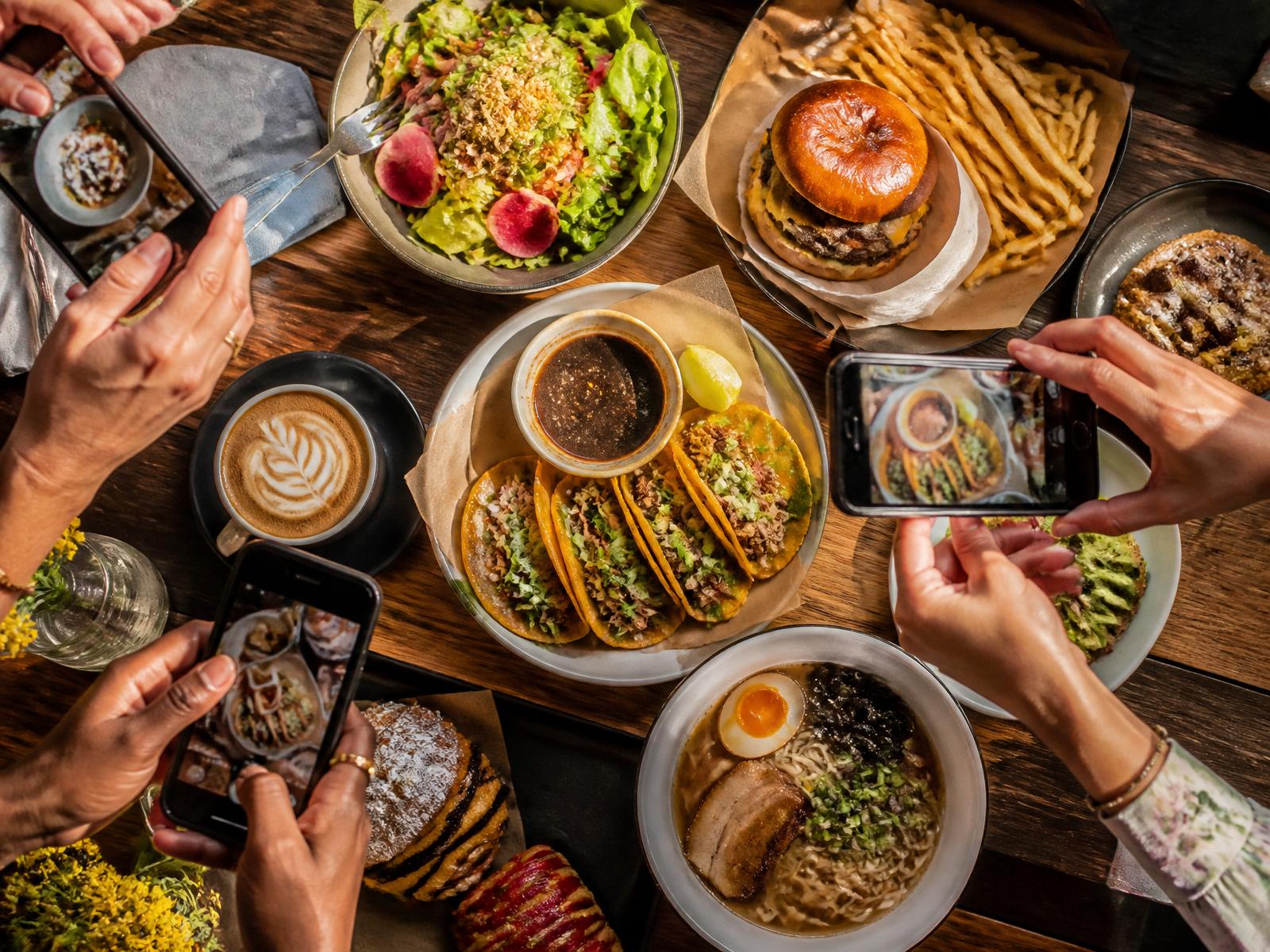 Friends photographing food